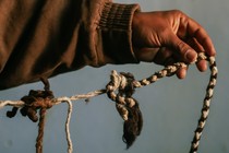 Victor Margarito holds up a khipu in Jucul, Peru, in April. (Photograph by Musuk Nolte for The Atlantic)