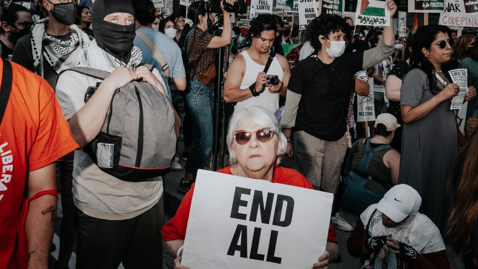 Protester holding sign in Pro-Palestine rally