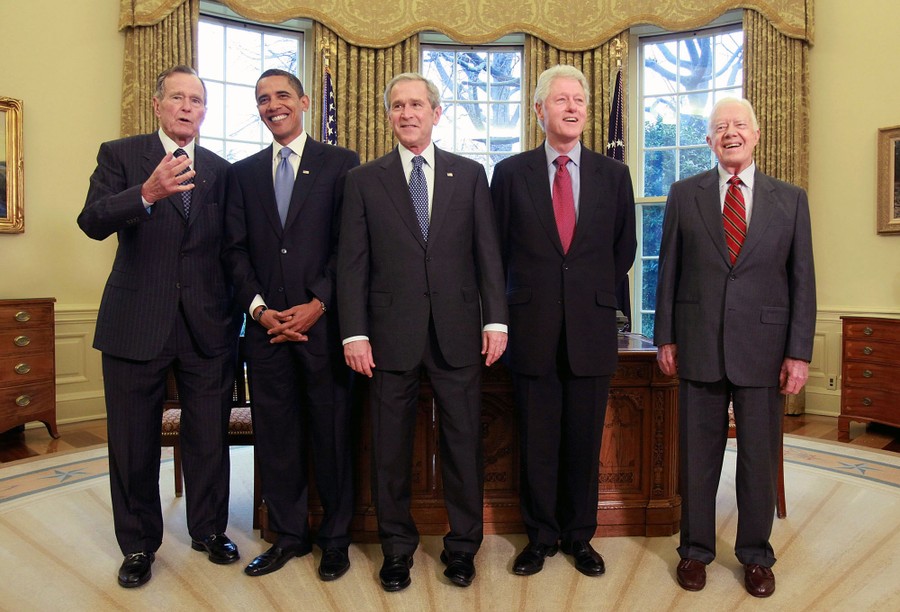 Three former presidents, one current president, and one president-elect stand together for a photo.