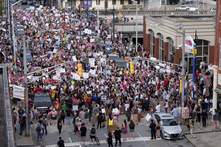 A large crowd of protesters in a city street