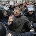 Police detain opposition leader Alexei Navalny outside a courthouse in Moscow on February 24, 2014.