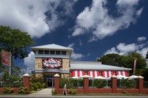 A TGI Fridays restaurant under a cloudy blue sky