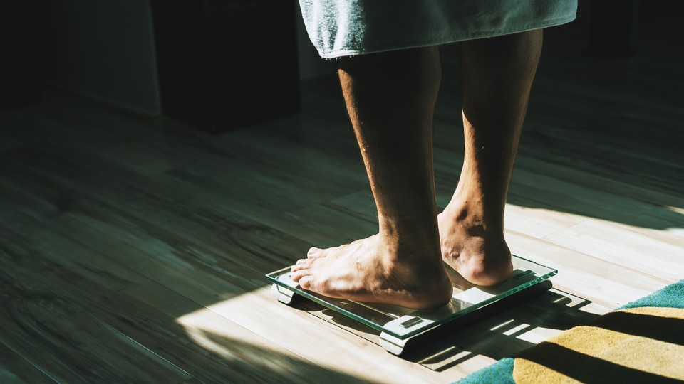 a person standing on a scale