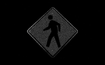 A pedestrian crossing sign