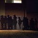 The shadows of voters lined up outside a 2016 caucus location in West Des Moines, Iowa.