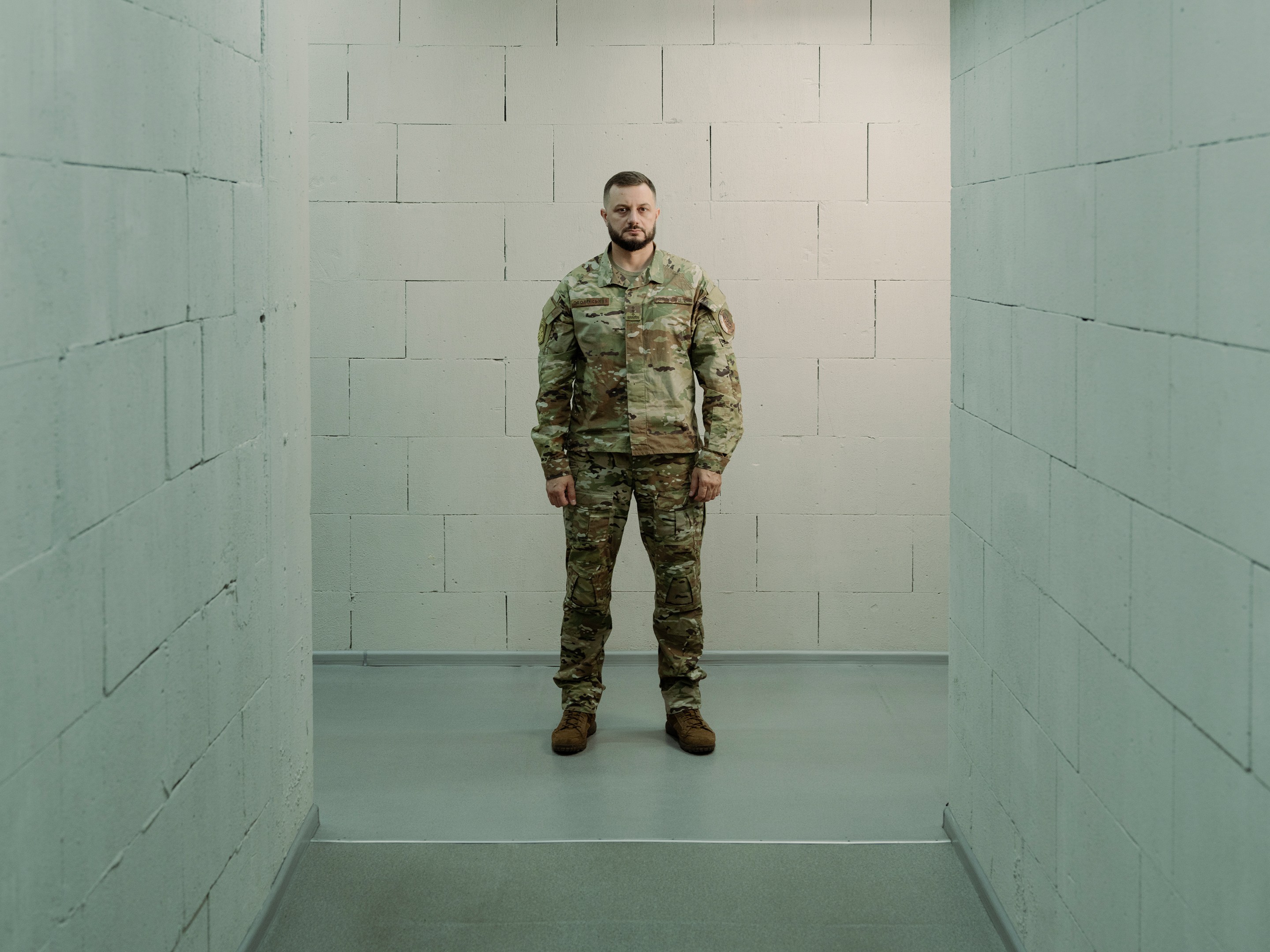 a soldier stands in a hallway