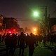 Protesters gather around a fire on a street in Mashhad the night f January 8