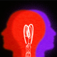 A graphic illustration of two silhouettes—one red, one purple—overlapping to form a lightbulb