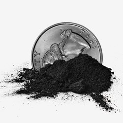 A quarter in a small pile of coal ash