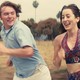 Cooper Hoffman and Alana Haim running outside in "Licorice Pizza"
