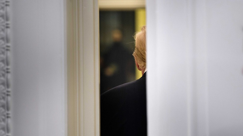 A door cracked open, with Donald Trump's back showing