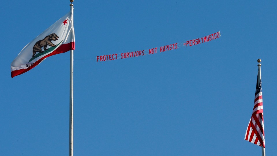 A plane flies over the Stanford stadium trailing a banner calling for the dismissal of the judge in the Stanford rape case prior to the Stanford University commencement ceremony in June.