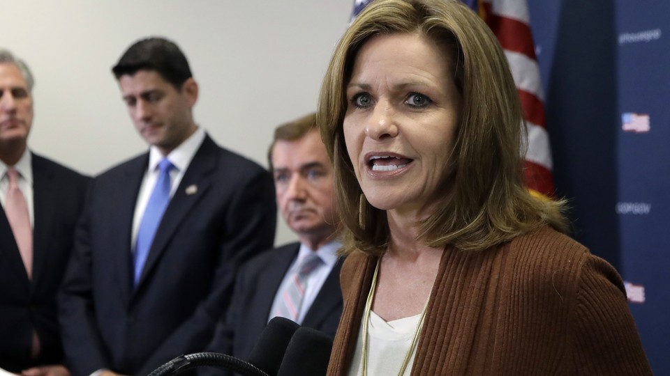 Representative Lynn Jenkins of Kansas speaks at a microphone during a press conference.