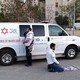 Two medics—one Jewish and one Muslim—praying in Israel.
