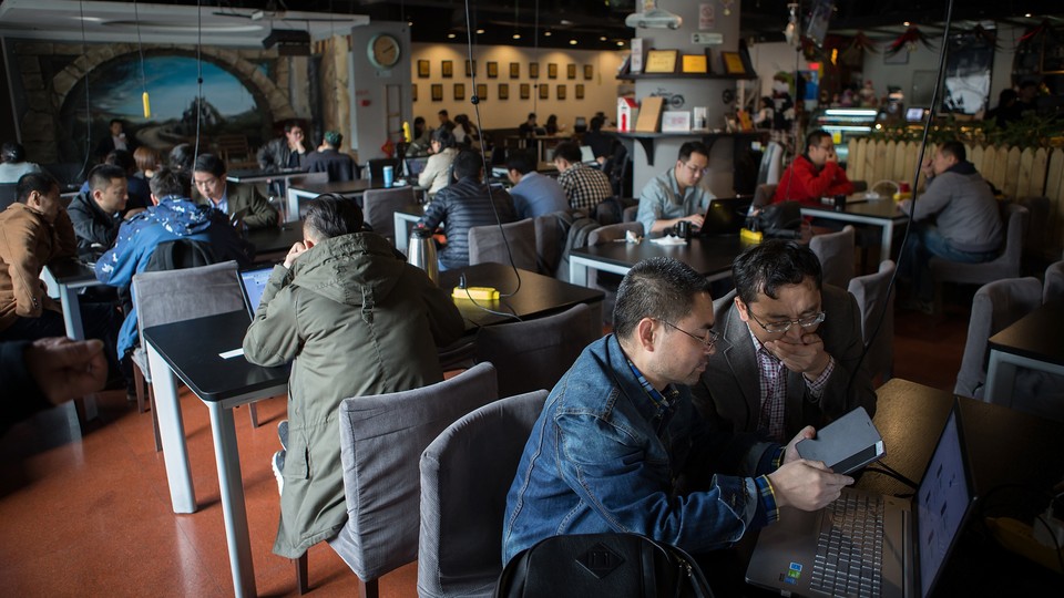 People sitting in Garage Cafe in Beijing, a meet-up space for investors and entrepreneurs