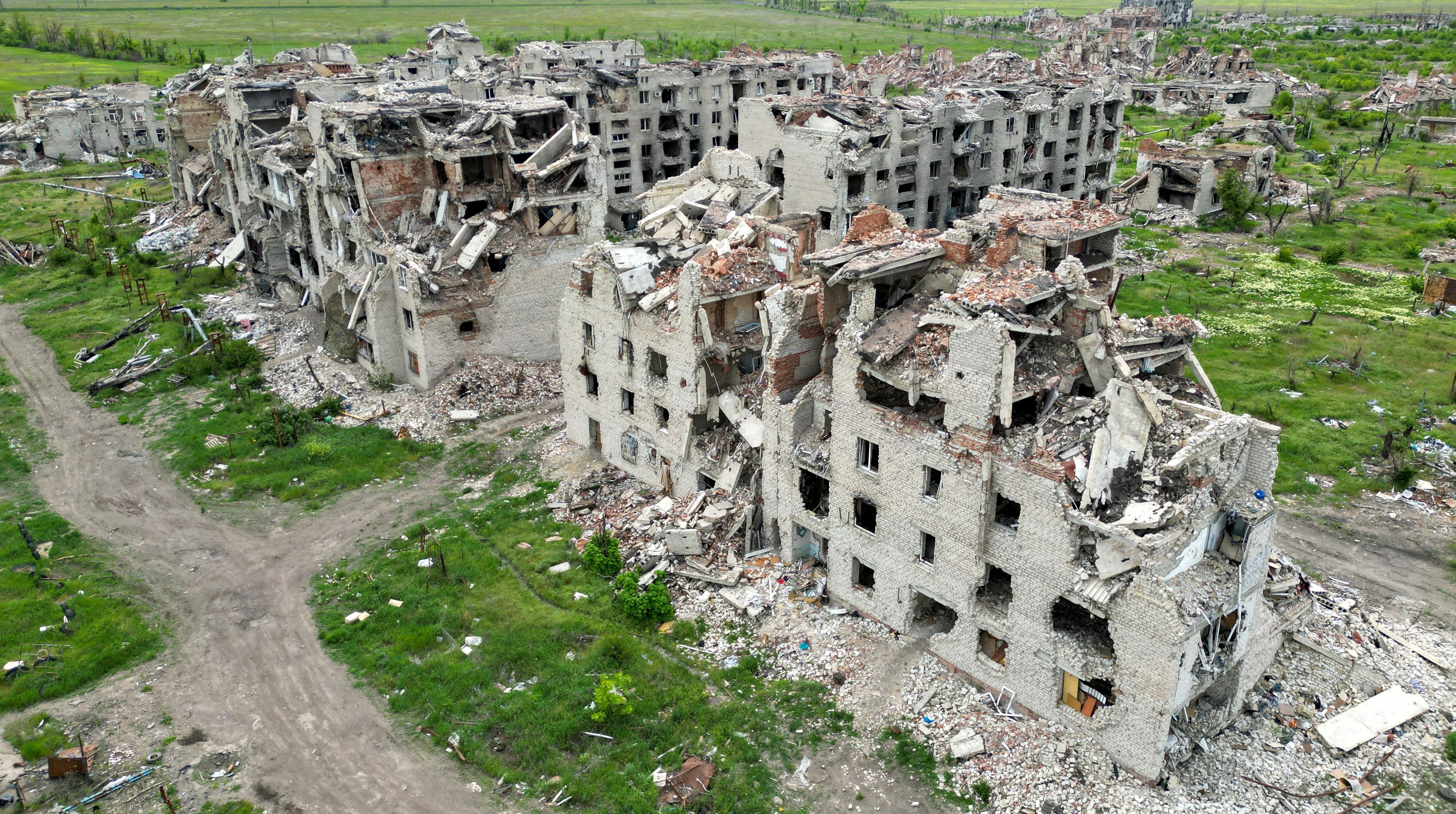 A drone view of the war-damaged ruins of large residential buildings in Ukraine