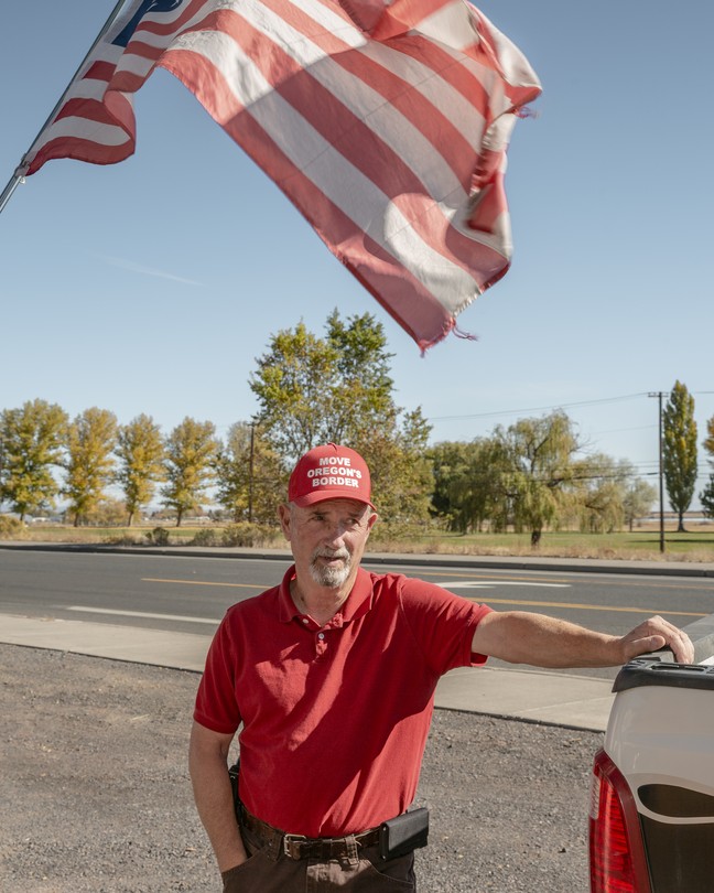 Mike McCarter, the head of Move Oregon's Border and Citizens for Greater Idaho, talks outside HC Sporting Goods ahead of a Move Oregon's Border meeting in Hines, Oregon, on October 16.