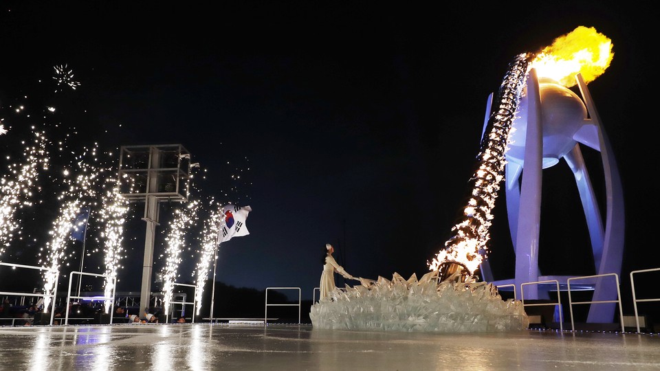 South Korean Olympic figure skating champion Yuna Kim lights the Olympic flame