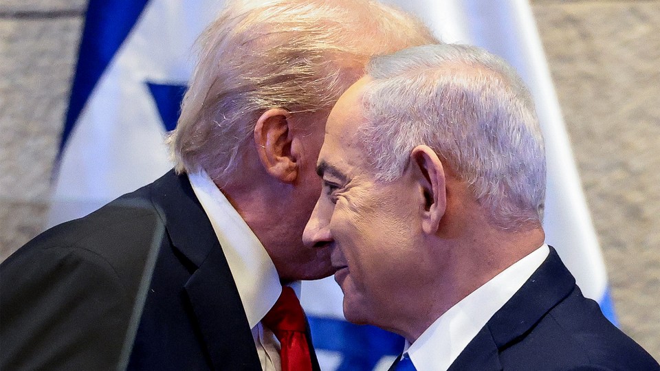 Trump leans in and whispers into Netanyahu's ear, and Netanyahu smiles slightly