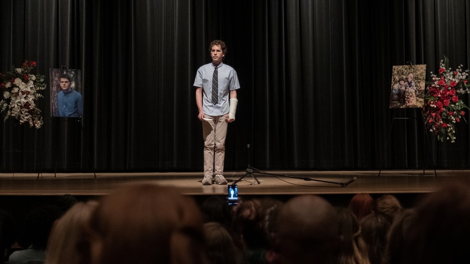 Evan Hansen, in the film 'Dear Evan Hansen,' on a stage, being filmed on a cellphone