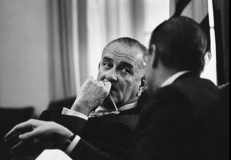 Picture of Lyndon B Johnson and Secretary of Defense Robert S McNamara  conferring at the White House, Washington DC
