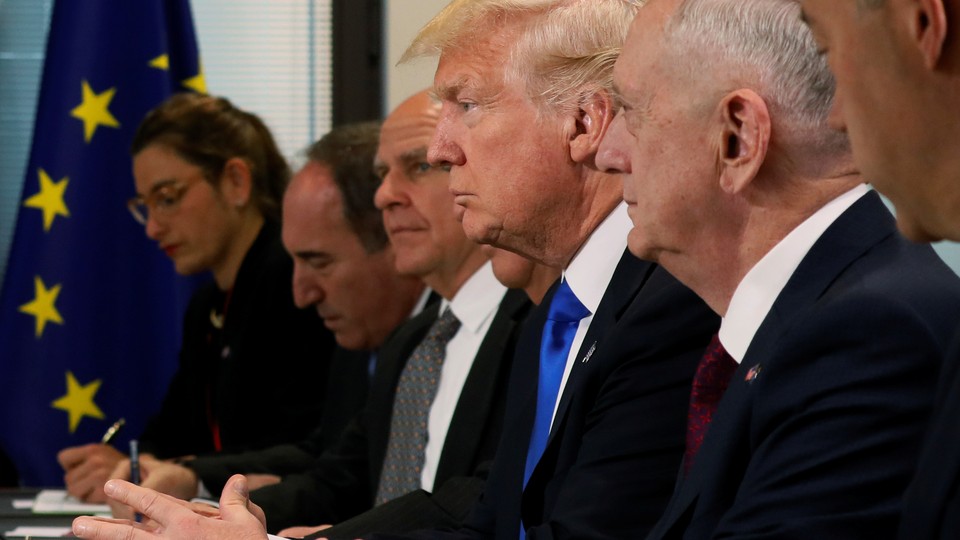 President Donald Trump sits with his delegation, including National Security Advisor H.R. McMaster and Secretary of Defense James Mattis during a meeting at the EU.