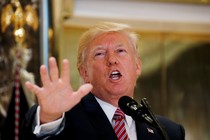 Donald Trump gestures at a press conference in Trump Tower.