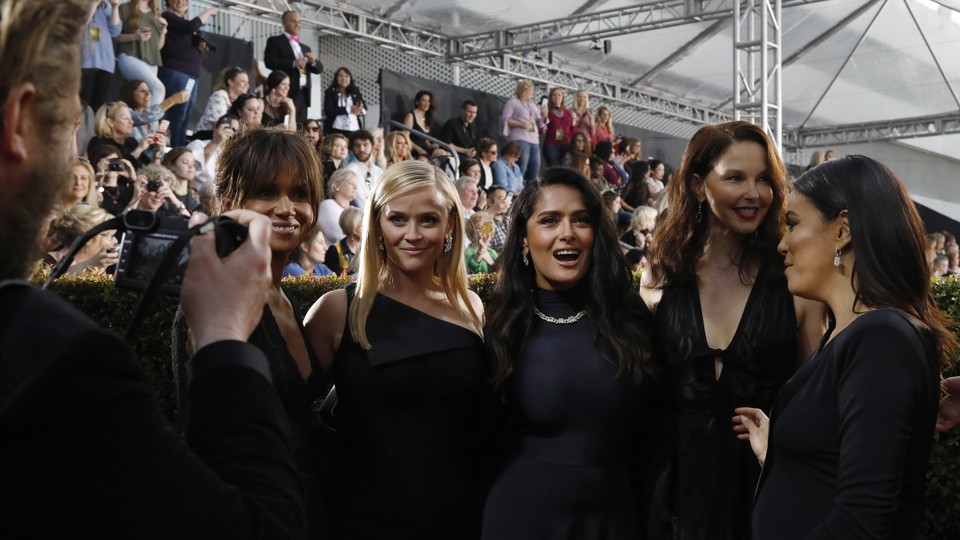 Actresses Halle Berry, Reese Witherspoon, Salma Hayek, Ashley Judd, and Eva Longoria on the red carpet of the 75th Golden Globes 