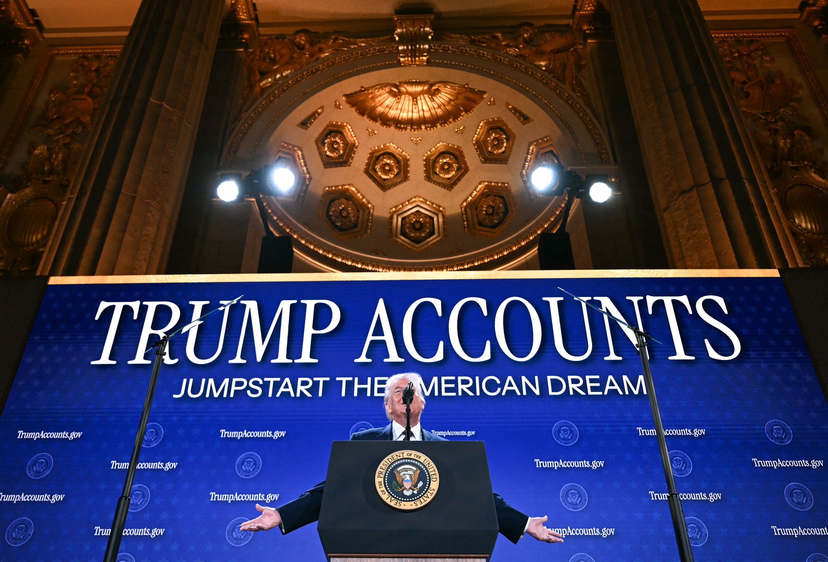 Donald Trump speaks at a podium