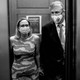 A black-and-white photo of Joe Manchin and Kyrsten Sinema in a Capitol Hill elevator