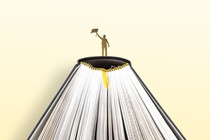 Person at the top of a book