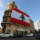 A Lebanese flag hangs from a building in downtown Beirut.