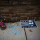 Memorial flowers and posters protesting the shooting of Justine Damond by police