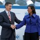 Michael Flynn and Susan Rice shake hands at a January 10 event in Washington.
