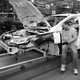 Workers build a Ford Focus on the assembly line at the Ford Motor Company's Michigan Assembly Plant on December 14, 2011, in Wayne, Michigan.