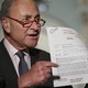 Senate Minority Leader Chuck Schumer of New York points to a copy of a White House–released rough transcript of a phone call between President Donald Trump and the president of Ukraine.