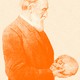 A man looks down, holding a skull