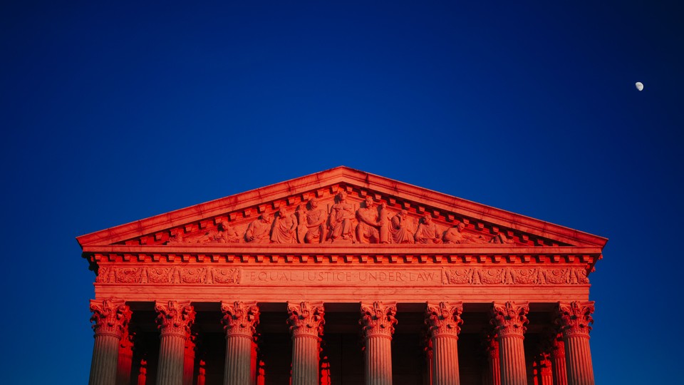 The Supreme Court in a reddish hue.