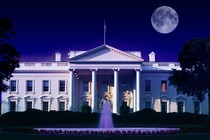 A composite image showing the White House with an eerie purplish background and a full moon