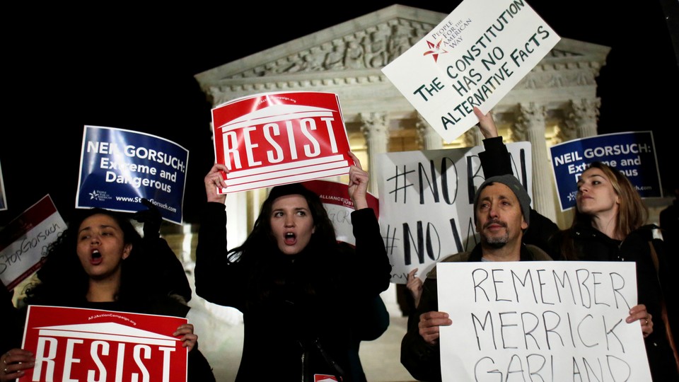 Demonstrators gather outside the Supreme Court building to protest President Donald Trump's appointment of Neil Gorsuch