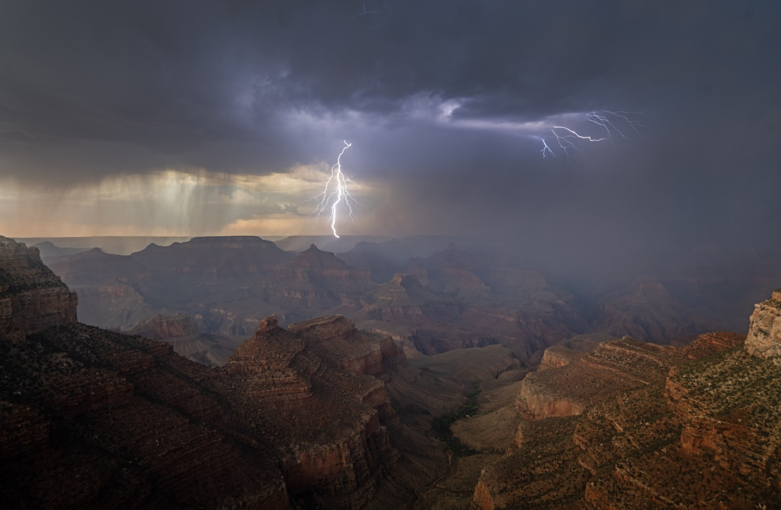 Lightning strikes over a wildfire burning on the North Rim of the Grand Canyon.