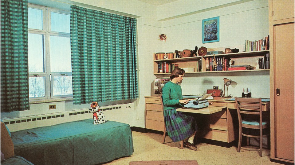 A drawing of a young woman sitting alone in a dorm room, on a typewriter