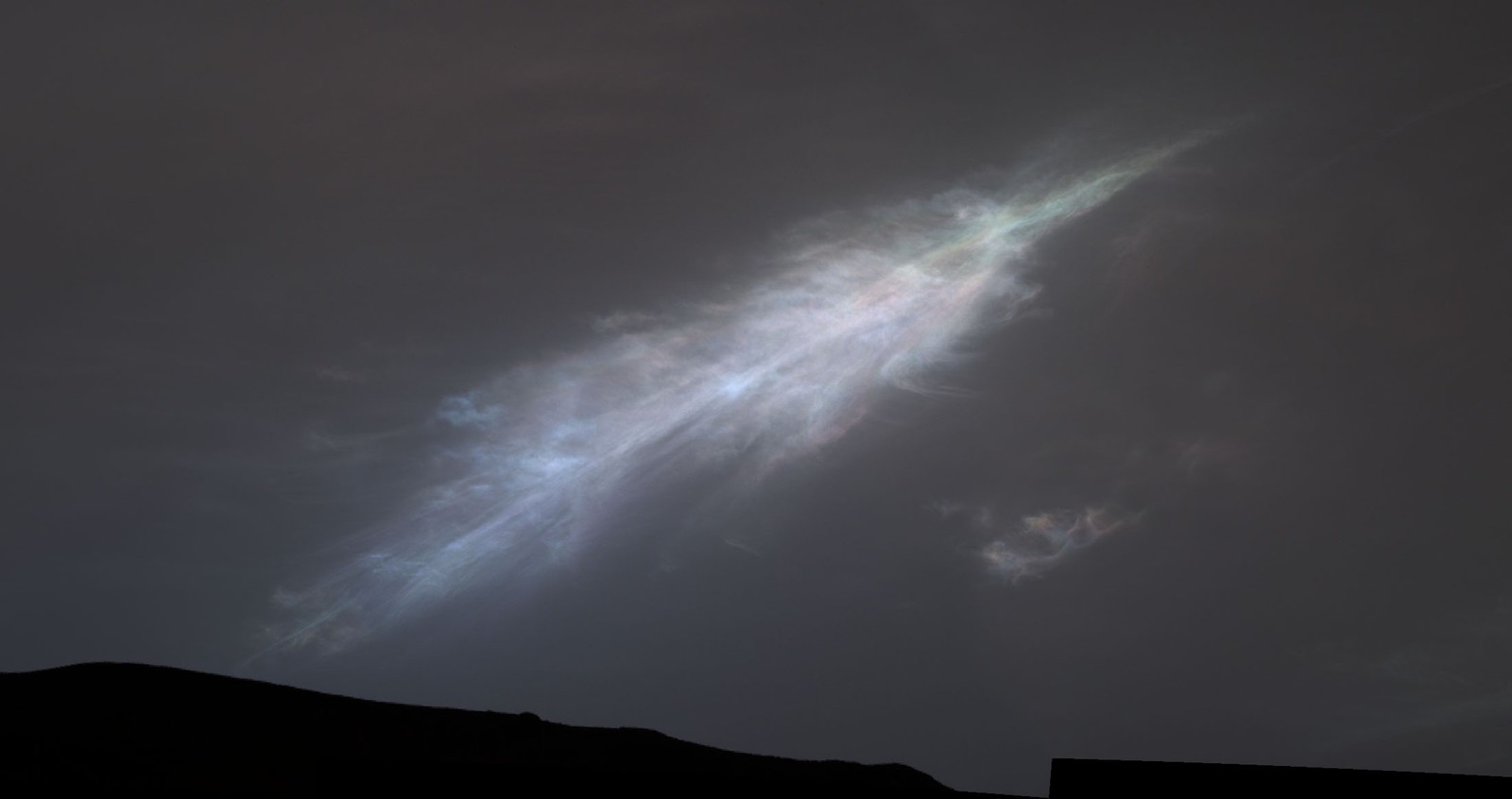 A high, feathery, slightly iridescent cloud