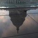 U.S. Capitol building reflected in a puddle