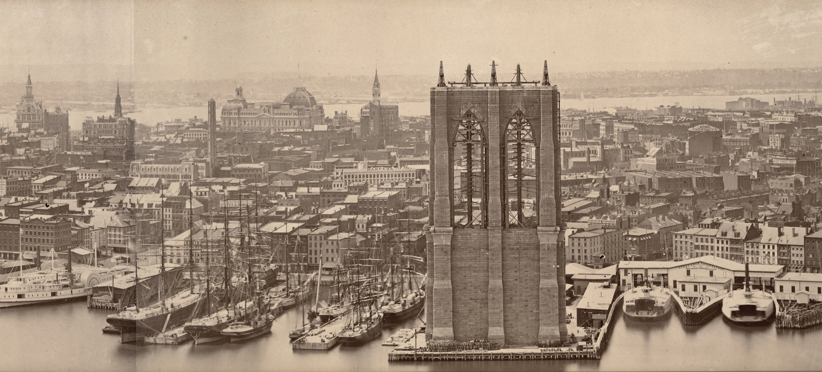 A view of downtown Manhattan, including a partially-finished Brooklyn Bridge, from 1876.