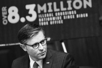 A black-and-white photograph of House Speaker Mike Johnson