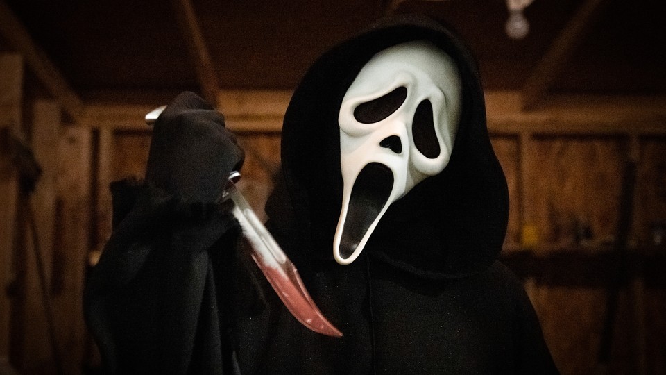 Ghostface holding a bloody knife in the newest "Scream" movie