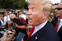 Donald Trump talks with journalists during a rally against the Iran nuclear deal