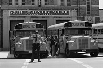 Students board buses. 