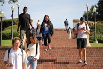 Students walking down steps on campus